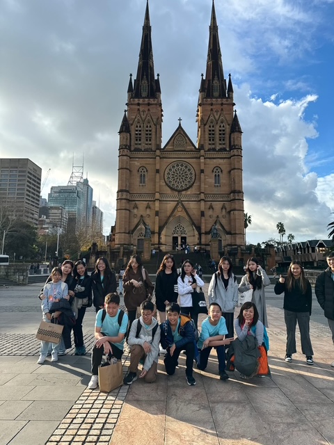 Study tour students posing in front of St Mary's Cathedral in Sydney